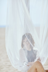 Portrait of Woman at Beach © LStockStudio