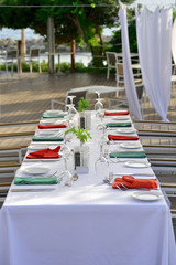 Served tables of the restaurant on the beach