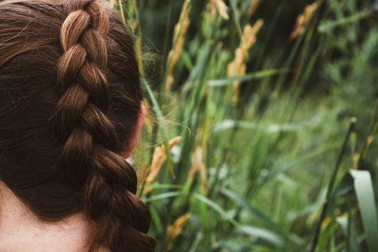 Back of a Young Girl's Braided Hair By A Prairie