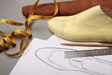 Modelling design of a shoes.Workplace of shoe designer Selective focus.Copy space.