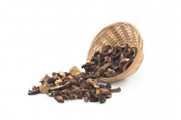 Dried mushrooms in a basket on a white background