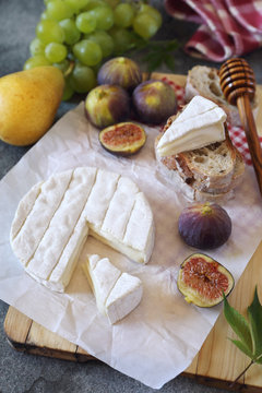  Camembert cheese, figs, fruits and bread