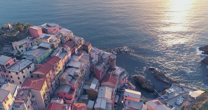 Amazing aerial view of Manarola village on cliff rocks and turquoise sea.Stunning view of beautiful and cozy town in Cinque Terre Reserve,Liguria,Italy,Europe.Travel destination, adventure concept.