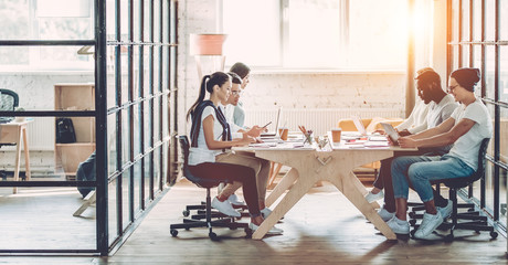 Young people work in modern office