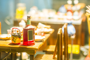 close up Miniature clay figurine Thailand's floating market,Miniature boat carrying tropical fruit on wood background