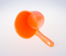 plastic water scoop. plastic water scoop on the background.