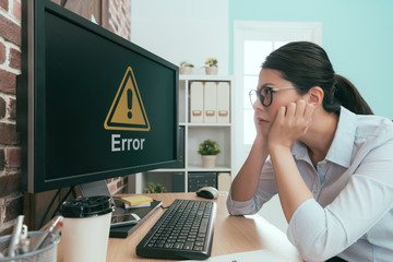 unhappy business lady looking at computer