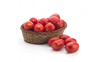 Tomatoes in a basket on a white background
