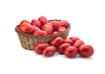 Tomatoes in a basket on a white background