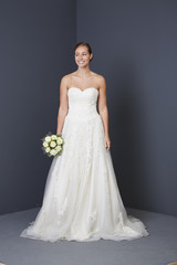 Stunning bride in white wedding dress, smiling