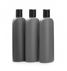 Grey bottles for shampoo on a white background