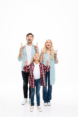 Fototapeta premium Full length portrait of an excited family with a child
