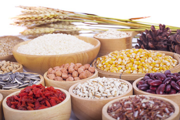 Cereal grains , seeds, beans on wooden background
