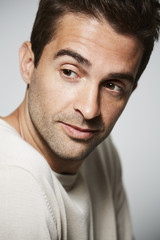 Fototapeta premium Thoughtful dude looking away, studio