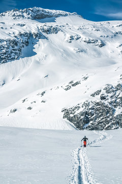 ski tourer on big mountains in a winterlandscape