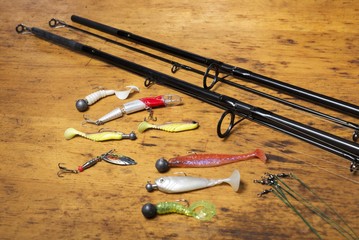 fishing sport background. Fishing stackle. Fishing rod with fishing reel and lures