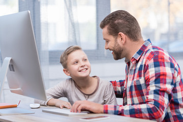 Fototapeta premium father and son with desktop computer