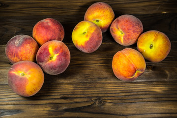 Ripe peaches on wooden table