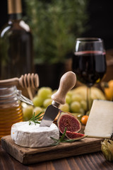Serving camembert cheese with herbs and fig
