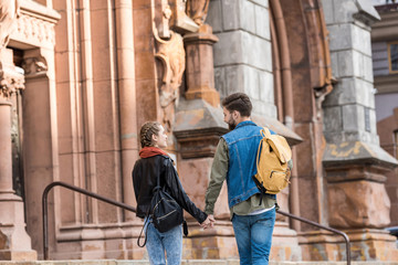 fashionable couple walking on street