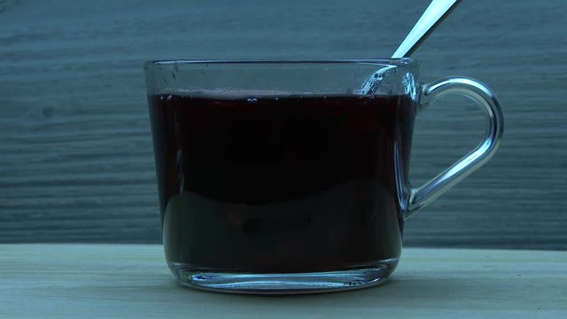 Sugar cubes fall in carcade tea