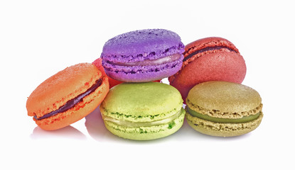 Delicious three multicolored macaroon on a white background