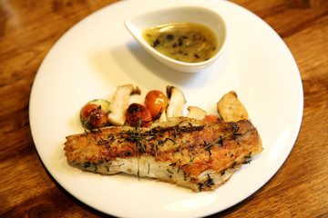 Sea bass fillet on wood background