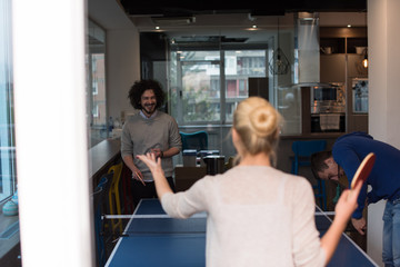 startup business team playing ping pong tennis