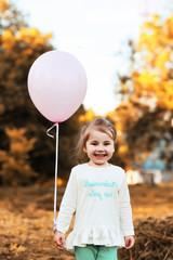 Little children are walking in autumn park