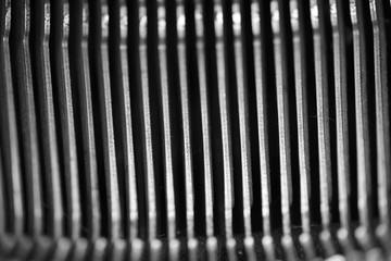 Different small metal elements of an old typewriter