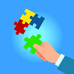 Hands assembling jigsaw puzzle 