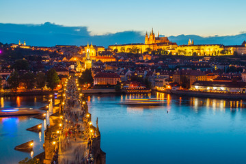 Hradcany evening panorama with Prague Castle, Charles Bridge and Vltava River, Prague, Czech Republic.