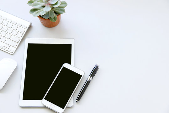 Business Concept,Working With Digital Tablet Computer, Mobile Phone ,keyboard,mouse And Spectacles On Table Background,Top View,flat Lay