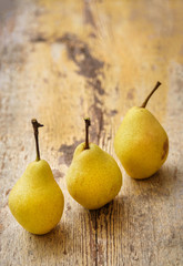 Bio Pears on rustic wooden background. Autumn fruits 