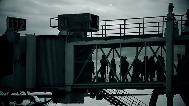Passengers boarding on airplane through a jetway