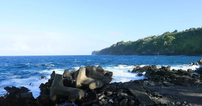 Rugged rocky shore along Big Island Ha. Destination for swimming, scuba and snorkel, underwater fish and coral. Big Island, largest, most volcanic active. Economy is tourism based. Water and tropical.