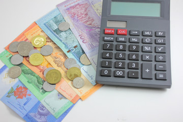 Malaysia bank note ringgit and calculator in white background