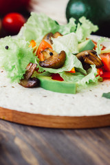 Natural vegetarian mexican food - fresh salad on tortilla bread.