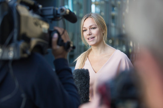 TV presenter talking to camera