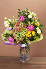Bouquet of different flowers, roses, carnations, gerberas, sunflowers, irises..