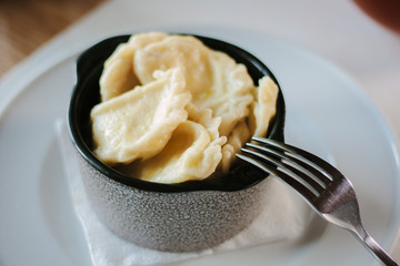 Russian food - dumplings on ceramic bowl.