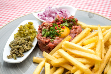tasty Steak tartare (Raw beef) - classic steak tartare on white plate