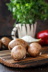 Food - mushrooms on wooden board on kitchen.