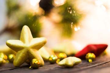 Red and Gold Christmas star  placed on wooden floor ,prepare for Christmas party