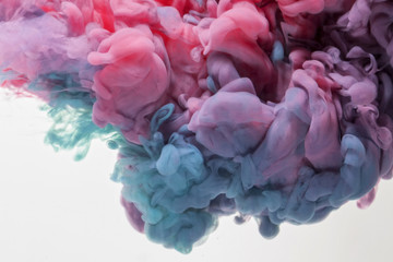  explosion of acrylic colors that create a cloud with soft and random shapes under water. concept of creativity and art.