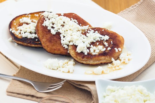 Homemade gluten free pancakes with cottage cheese served on oval plate