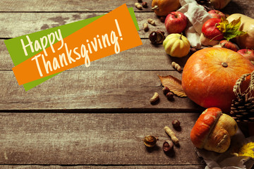 Happy thanksgiving day display on wooden background