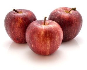 Three whole Gala apples isolated on white background