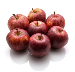 Whole Gala apples folded in a flower isolated on white background