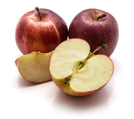 Gala apples, two whole, one half and slice, isolated on white background